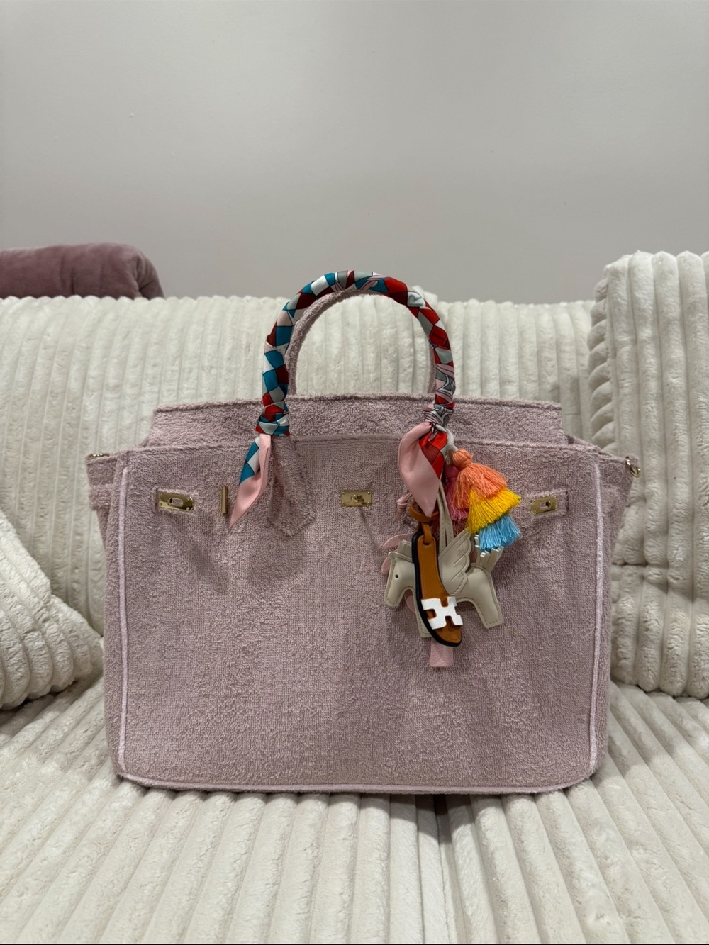 Textured Blush Pink Tote with Colorful Wrapped Handle and Tassel Accent